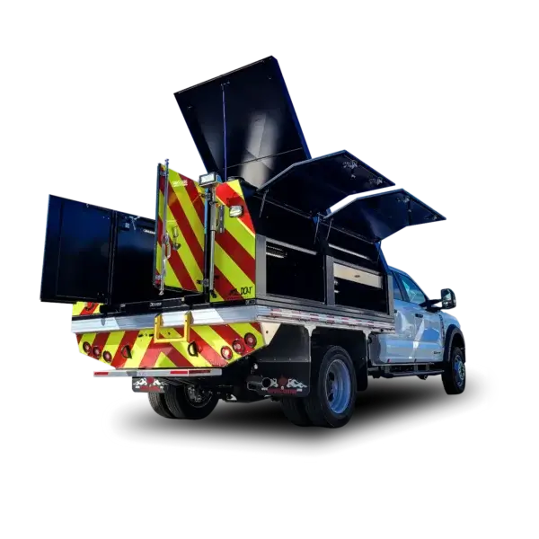 The Wildcat 950, a utility truck with storage compartments accessible from both sides and rear and red/yellow reflective stripes, is shown on a black background—perfect for transporting wildfire equipment in Canada.